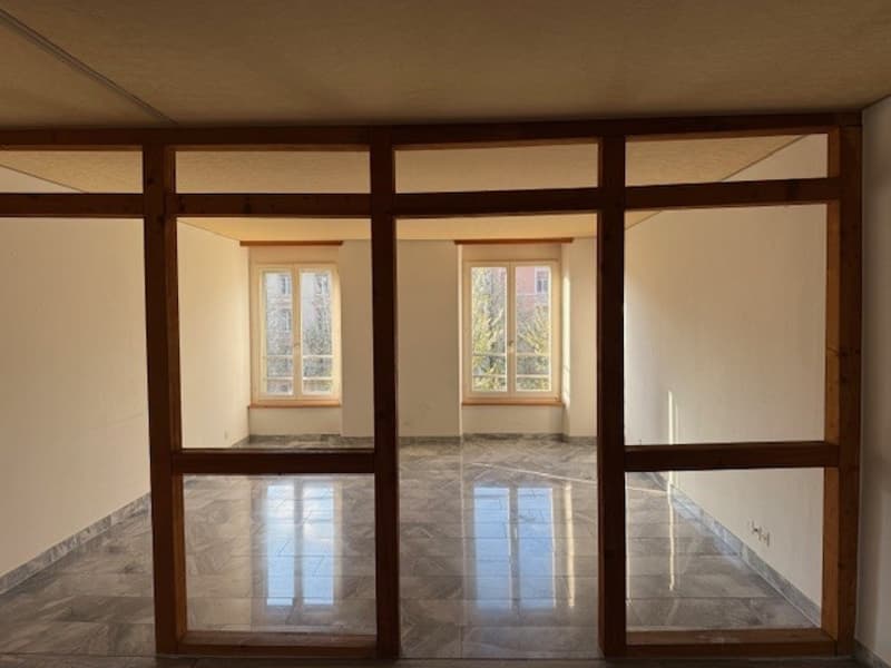 empty room, wooden frames, tiled floor, two windows