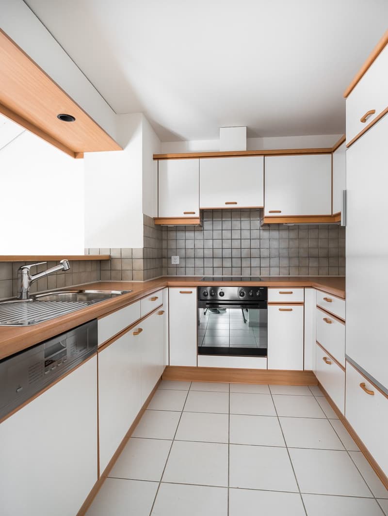 modern kitchen, white tiles, white cabinets, wooden countertop, integrated oven, dishwasher, sink