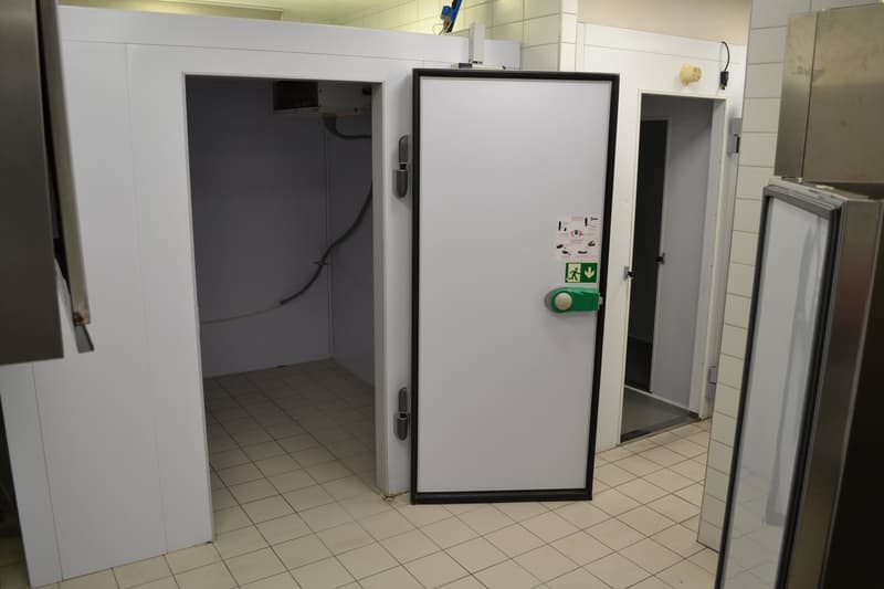 commercial refrigeration unit with two compartments and tiled floor