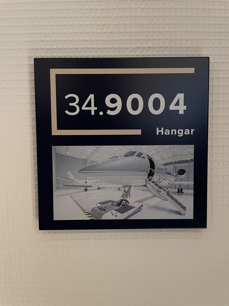 Number 34.9004 in bold with a hangar picture beneath it