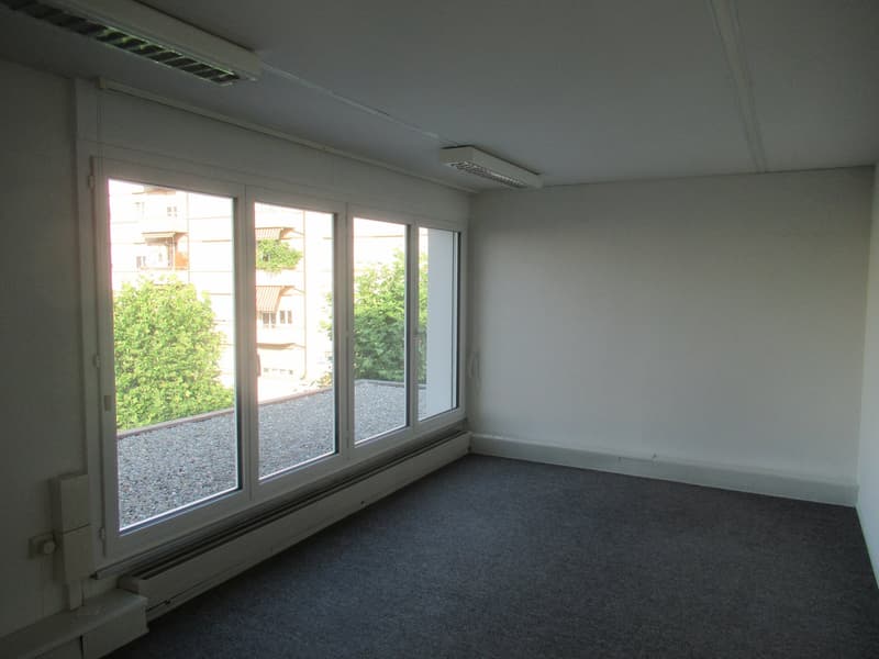 empty room, white walls, floor heating, large windows, balcony