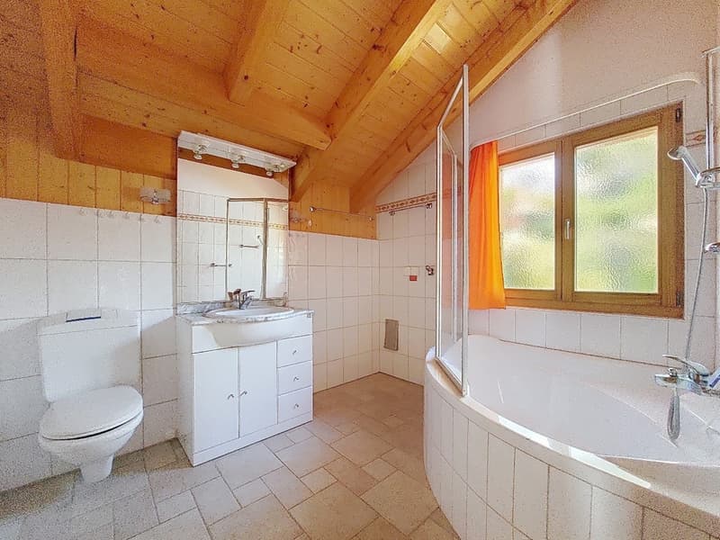 white tiled walls, wooden ceiling, white toilet, white sink, bathtub, shower, window with curtain