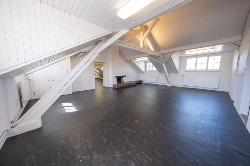 Empty room, wooden beams, wooden floor, fireplace