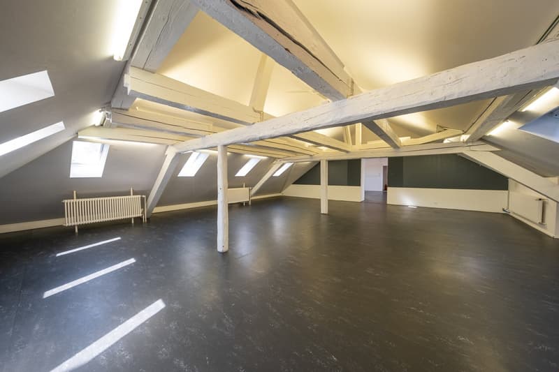 empty room, wooden beam ceiling, radiator, windows