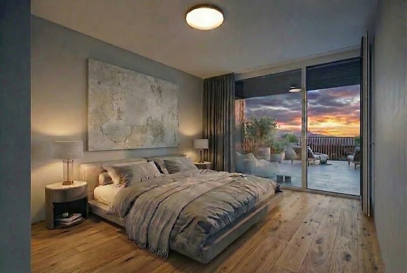 large bed, wooden floor, bedside tables, lamps, large painting, sliding glass doors, balcony, sunset view