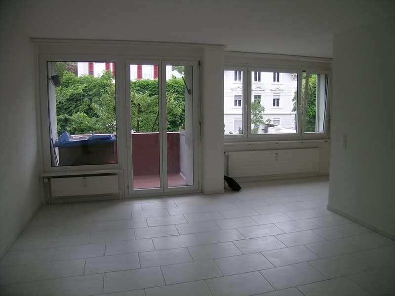 empty room, white tiles, sliding glass doors, balcony, white walls, white radiators