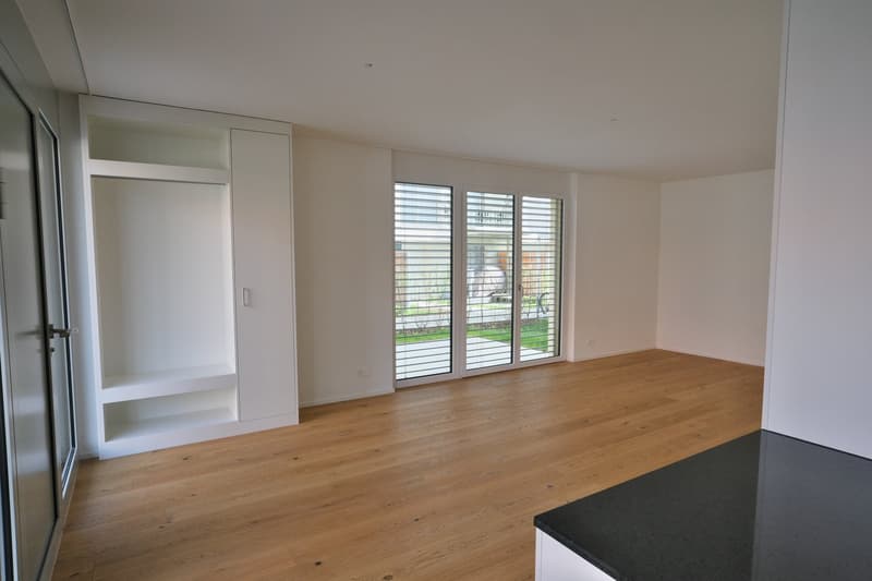 empty room, wooden floor, sliding glass doors, white walls, built-in wardrobe