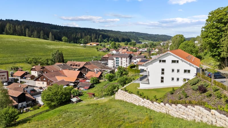 Raised ground floor house, red roof, located in a hilly village with beautiful view