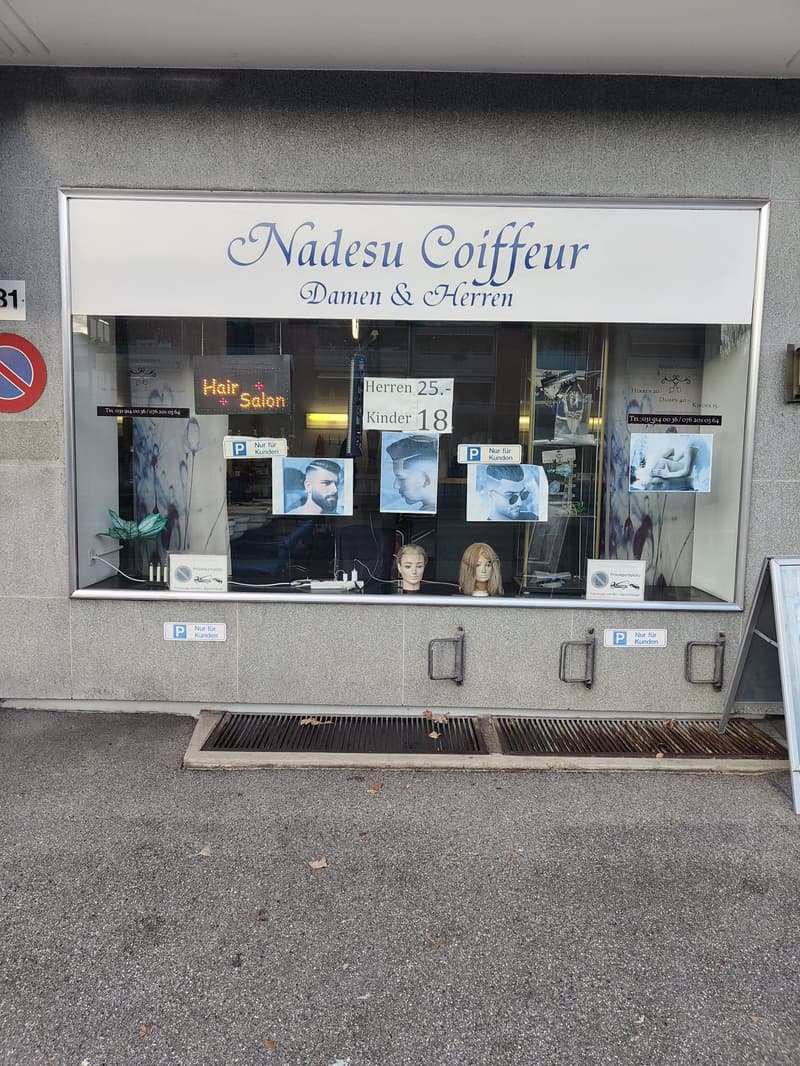 Hair salon with 'Nadesu Coiffeur Damen & Herren' sign, mannequins in the window, no visible real estate features