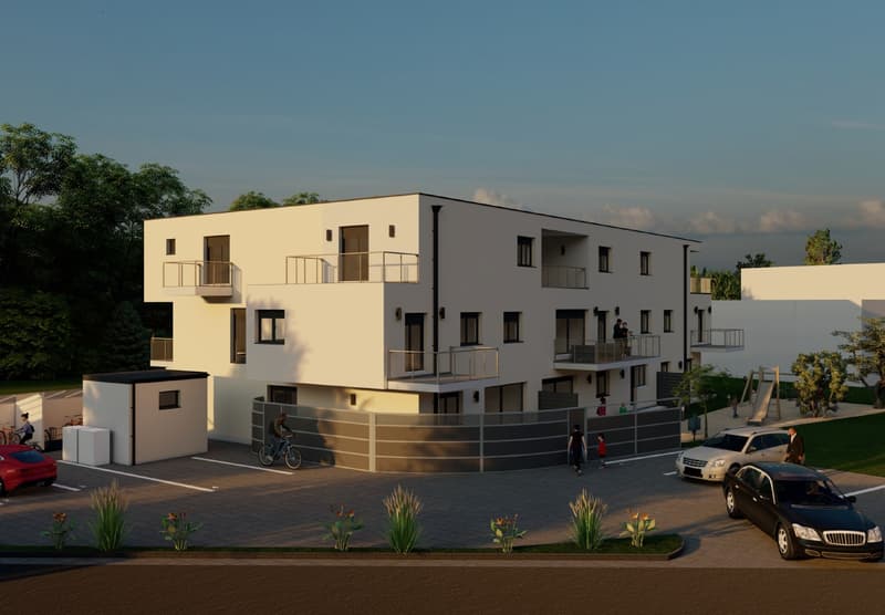 Two story residential building, white walls, balconies, parking area, cars parked, garden