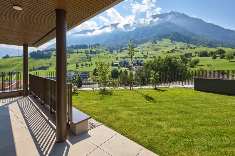 wooden ceiling, metal railings, metal bench, fenced terrace, view of grassy hills and mountains