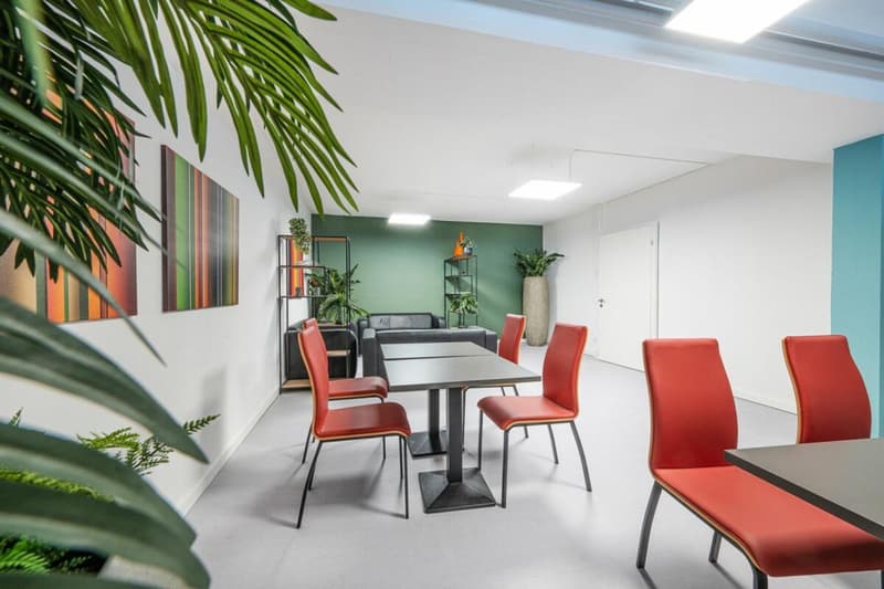 modern interior design, white and green walls, 4 red chairs around table, tables, plants, lamps on ceiling