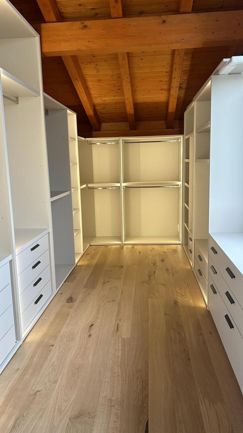 wooden ceiling, wooden floor, white built-in wardrobes, drawers