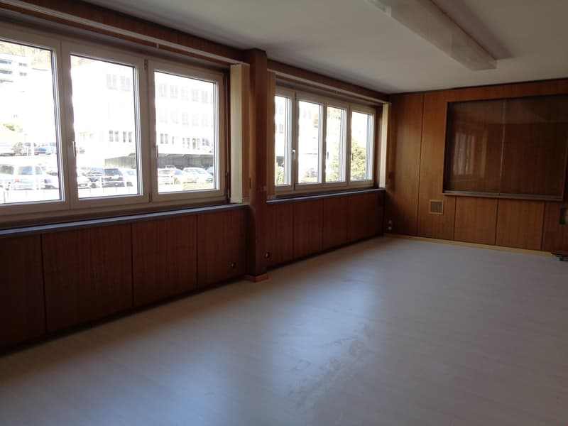 wooden walls, large windows, white floor, ceiling light