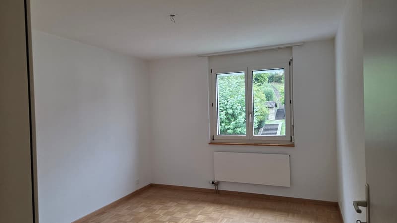 empty room, wooden floor, white walls, single window