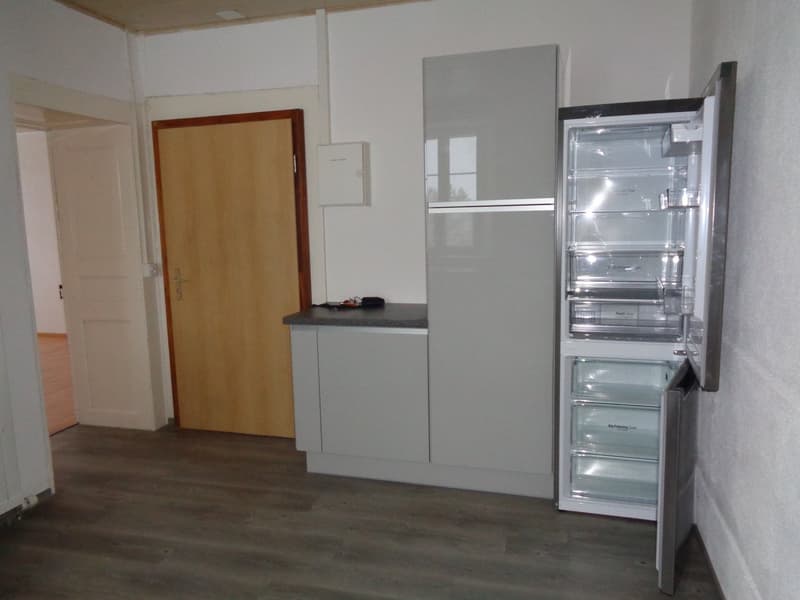 Modern kitchen, refrigerator, cabinets, countertops, floor