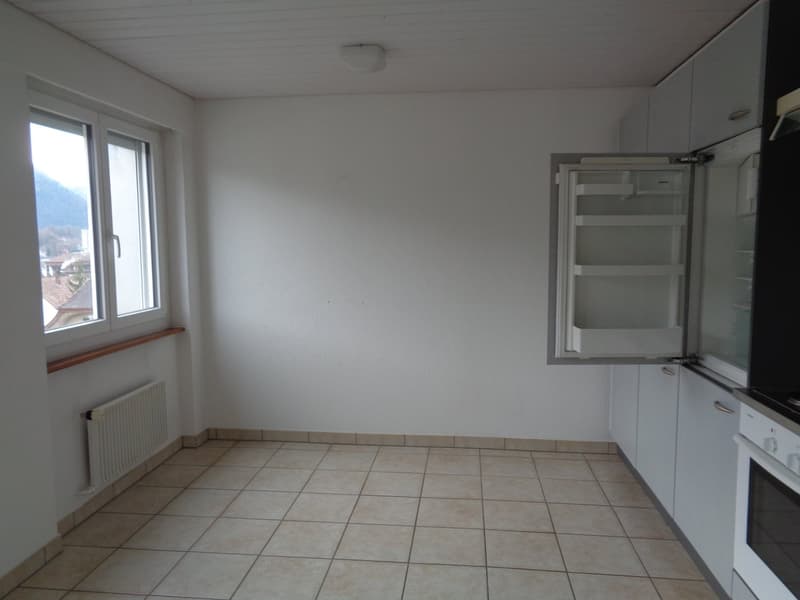 empty room, tile flooring, open refrigerator, white walls, windows, radiator