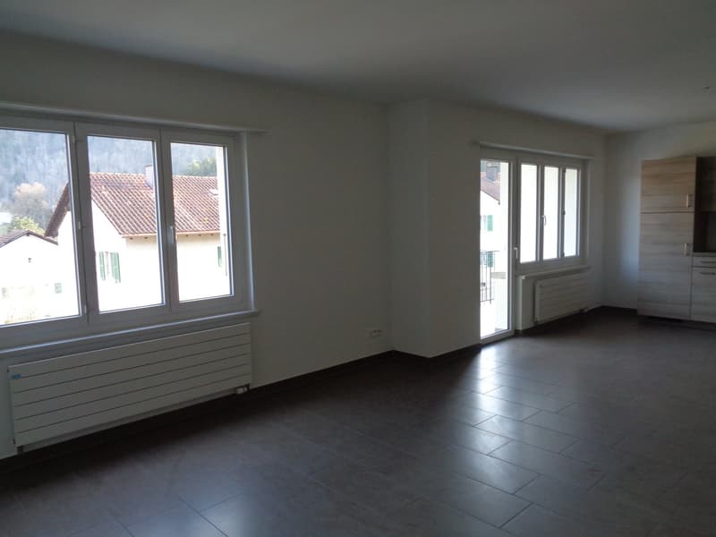 empty room, white walls, large windows, tiled floor, white radiators