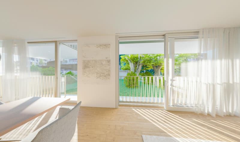 Dining area with wooden floor, large windows, balcony with fence, table, and chairs, white curtains, painting on the wall