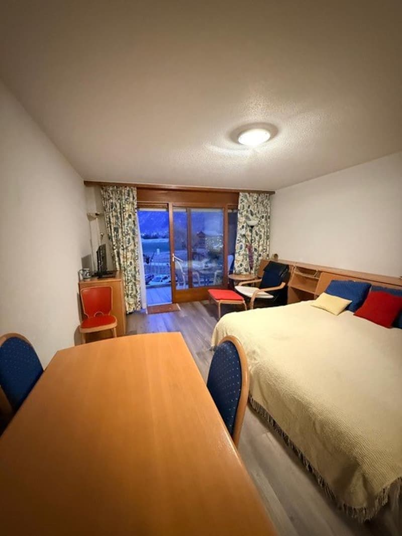 bedroom, bed, chairs, desk, sliding doors, balcony