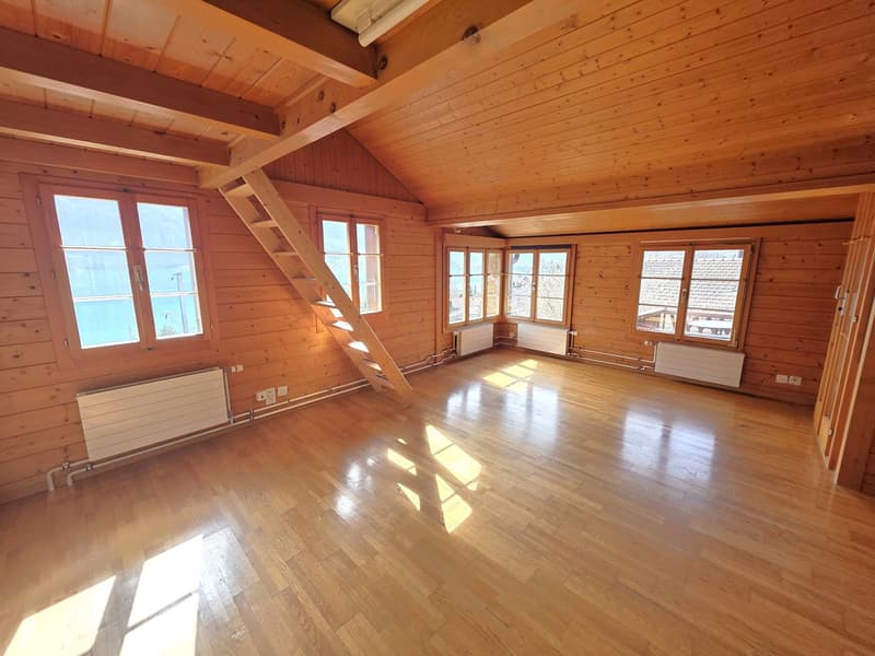 wooden walls, wooden floor, large windows, wooden staircase, radiators