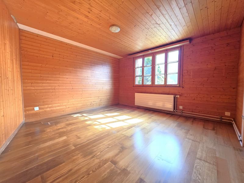 empty room, wooden walls, wooden floor, window, radiator