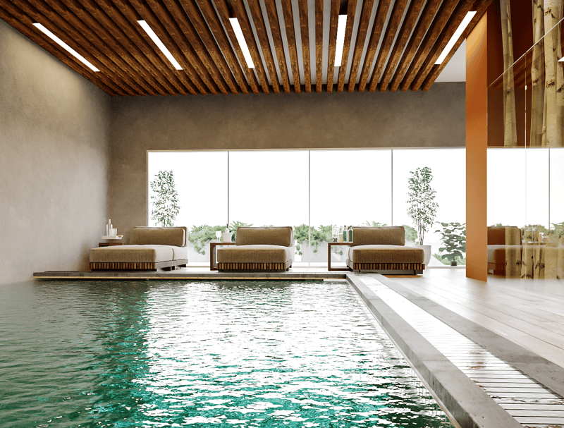 Indoor swimming pool, wooden ceiling, large windows, lounge chairs, wooden floor