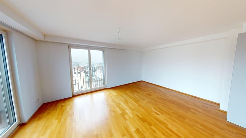 empty room, hardwood floors, large sliding glass doors with balcony, white walls