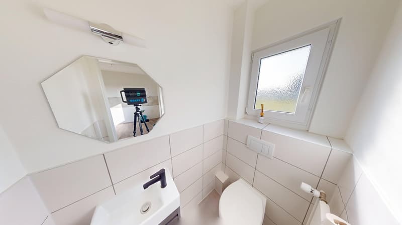 modern bathroom, white tiles, modern sink, toilet, mirror, natural light from window