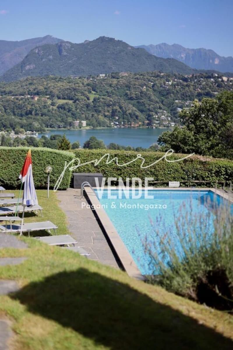 Habiter avec panorama : appartement 4.5 pièces avec vue sur le lac et piscine à Agno (20)