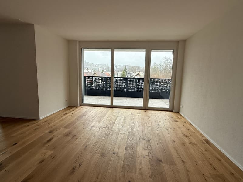 empty room, hardwood floors, sliding glass doors, balcony, white walls