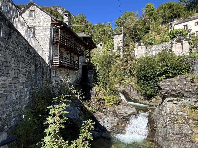 Stone house, wooden balcony, waterfall, mountain, trees, plants