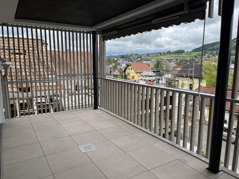 tiled floor, metal railing, metal awning, drain, view of the city