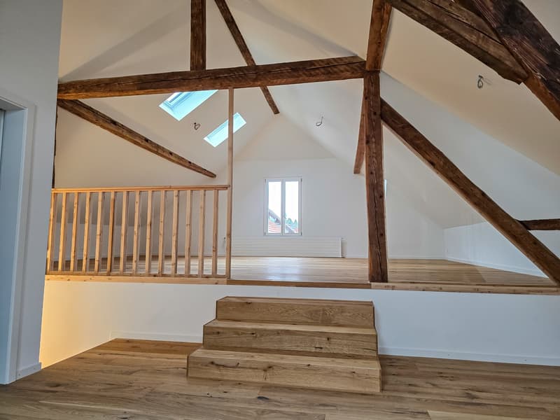 wooden beams, wooden stairs, wooden floor, skylights, white walls
