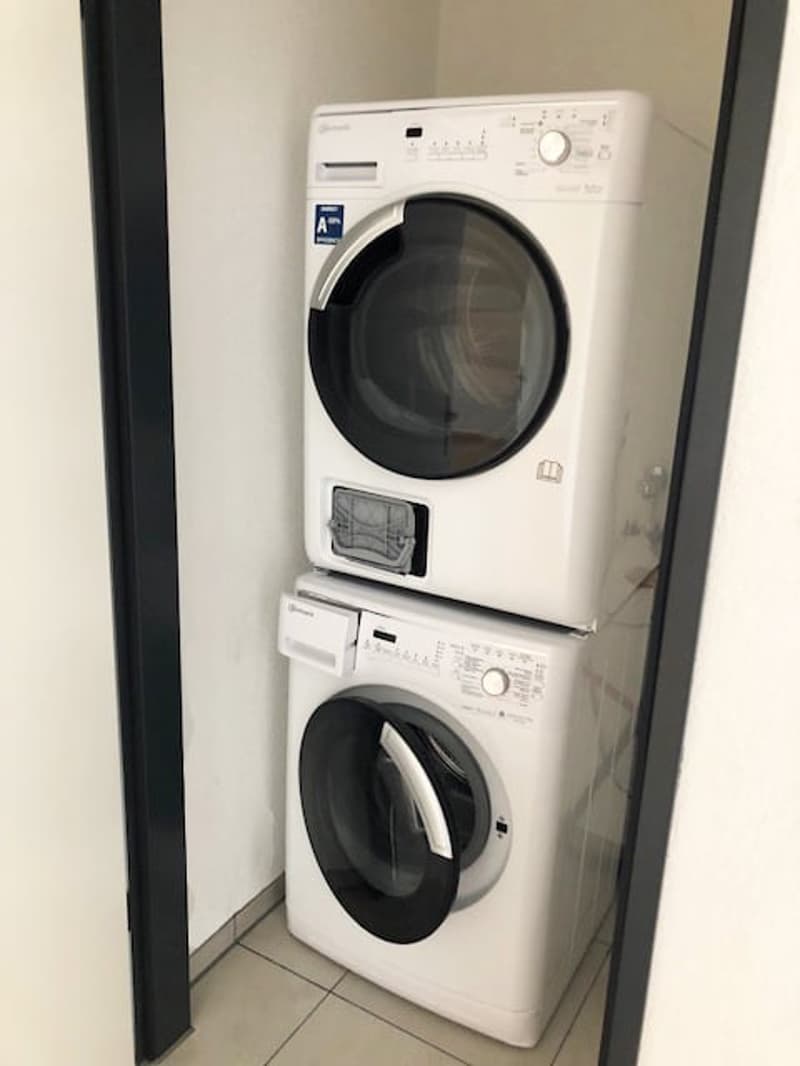 Stacked washing machine and dishwasher in a corner