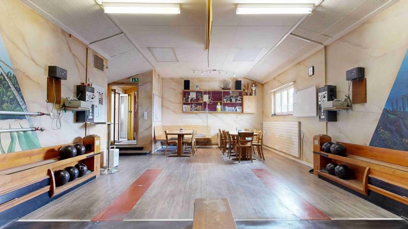 wooden floor, wooden benches, dining table, chairs, shelves, clock, speakers, air conditioners, paintings