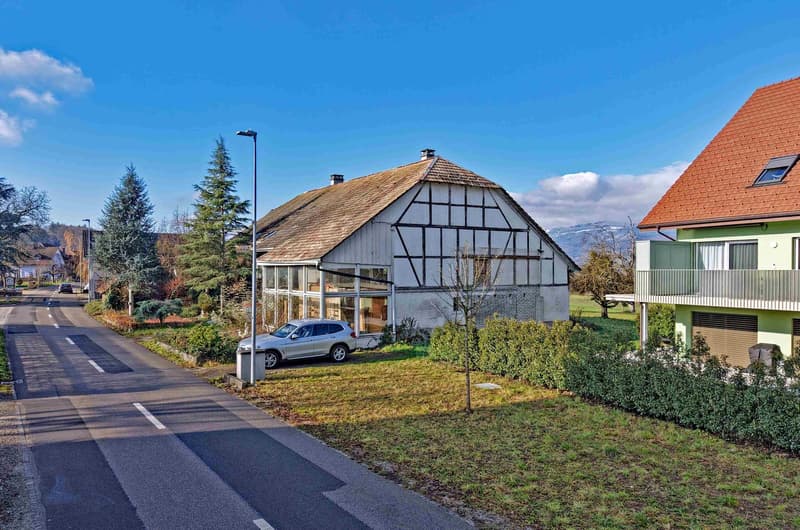 detached house, brown roof, glass windows, car parked in front, side road