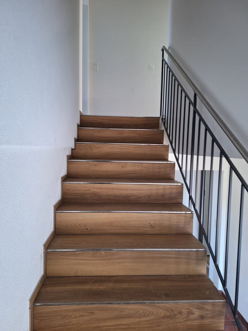 Wooden staircase with metal railings