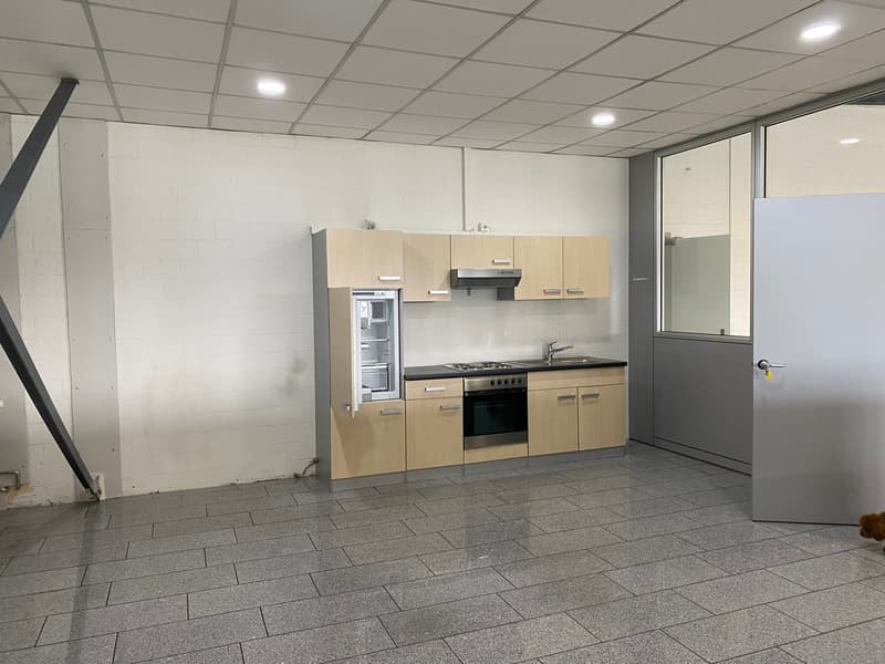 empty room with modern kitchen and tiled floor
