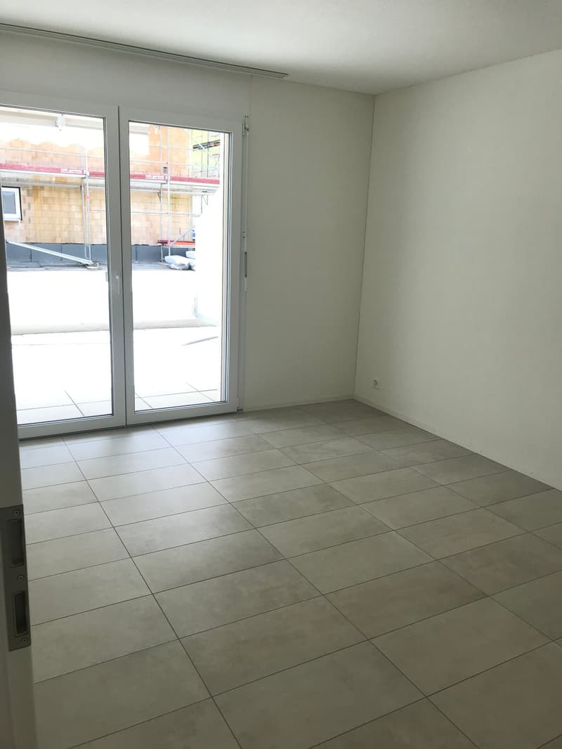 empty room, sliding glass doors, balcony, tiled floor, white walls