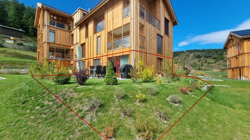 3 story wooden house, large windows, balcony, outdoor dining area, green lawn