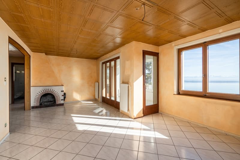 tiled floor, fireplace, large windows, sliding doors, wooden ceiling