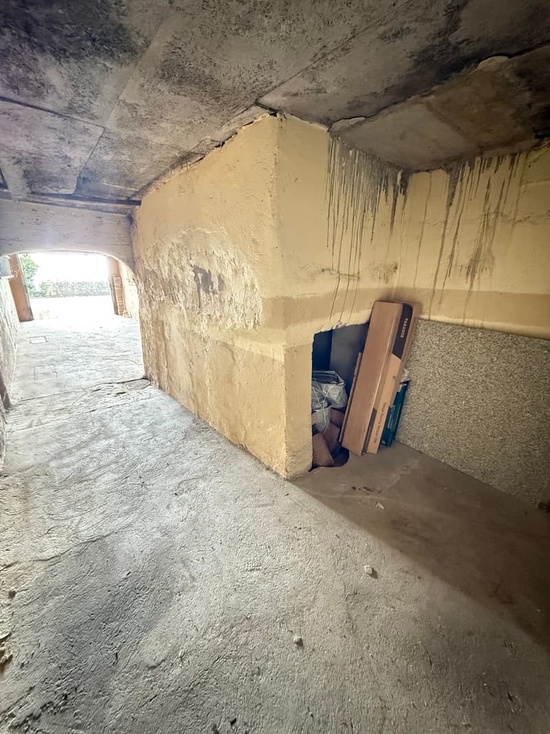 concrete floor, yellow walls, storage space, items inside