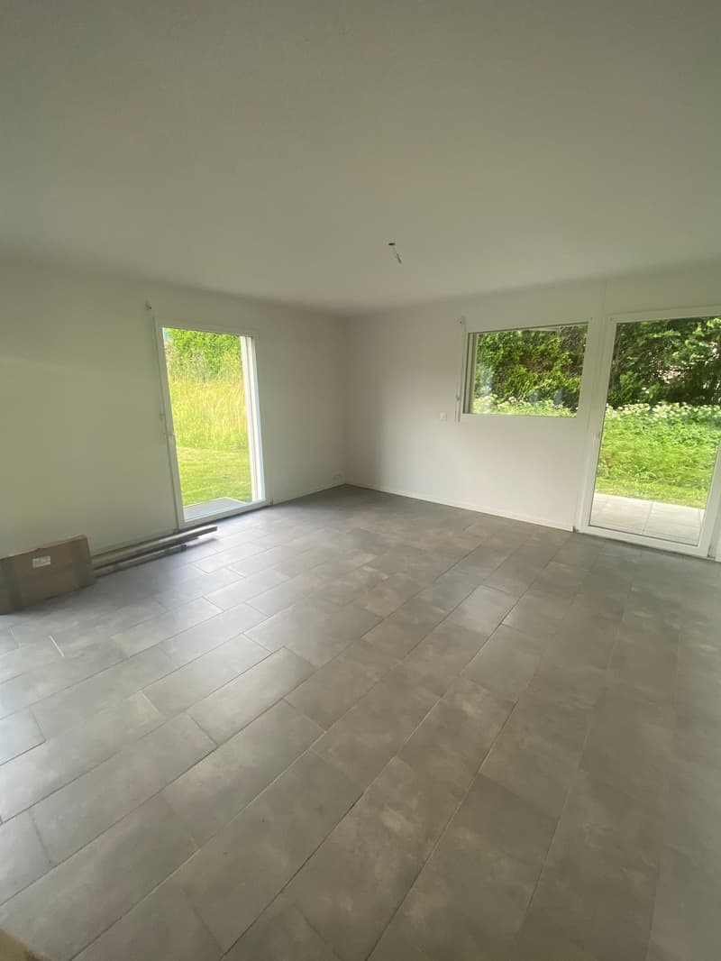 empty room, white walls, gray tiles, sliding glass doors, balcony
