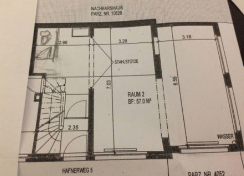 Floor plan with dimensions and room labels, including Raum 2 with a floor area of 57.0 m².
