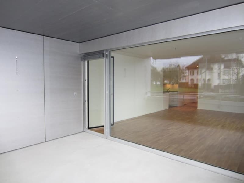 slidable window, wooden floor, large windows, no furniture