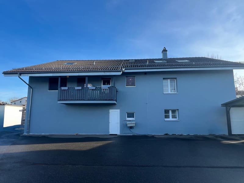 Blue house, two-story, modern style, terrace on the second floor, two garage doors