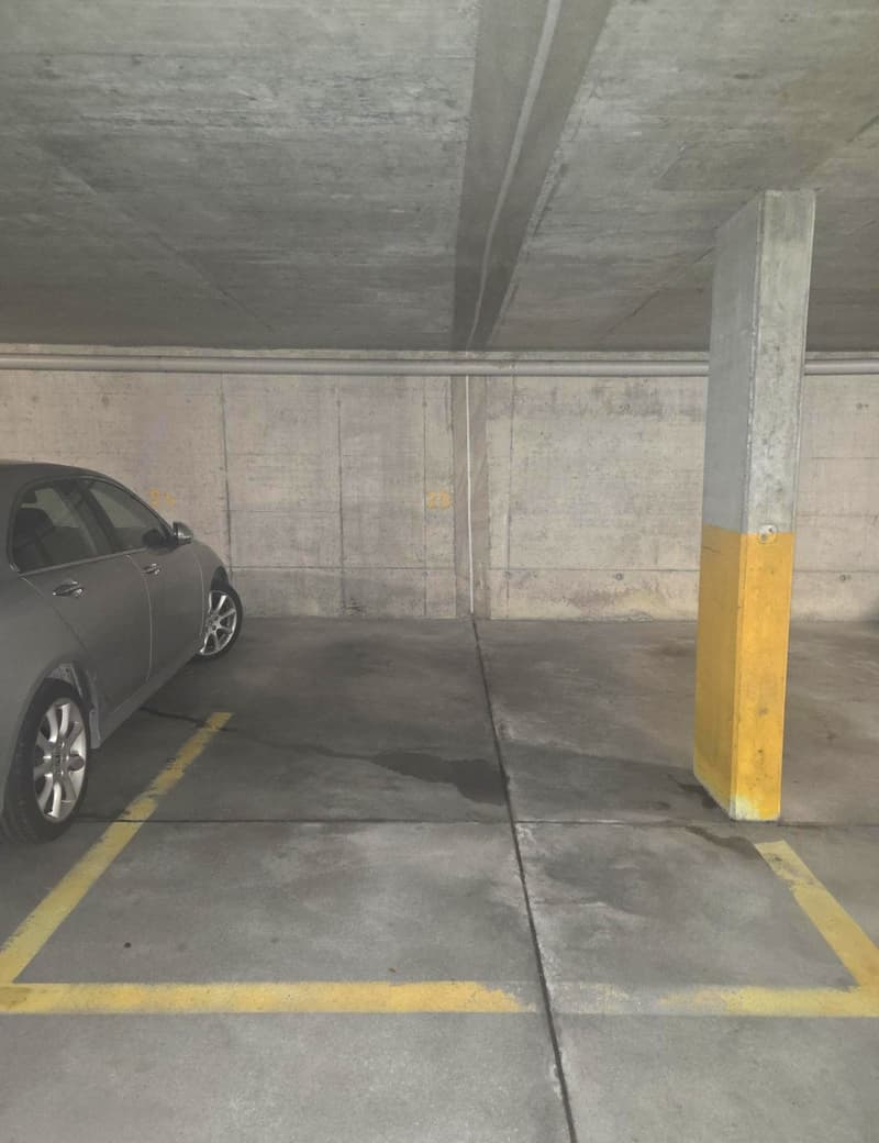 concrete floor, walls, ceiling, pillars, car parking space, yellow lines