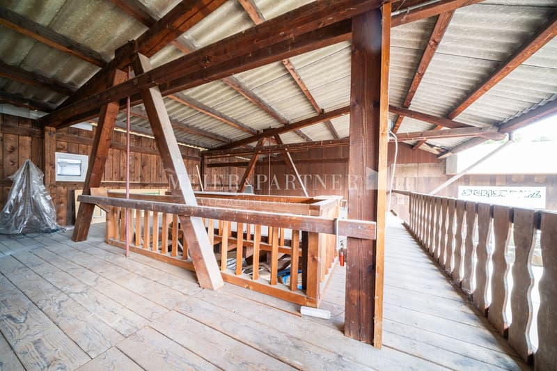 Wooden beams and trusses, wooden floor, open space, storage area