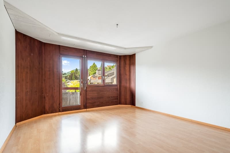 empty room, hardwood floors, white walls, wooden doors, sliding glass doors, balcony, white ceiling
